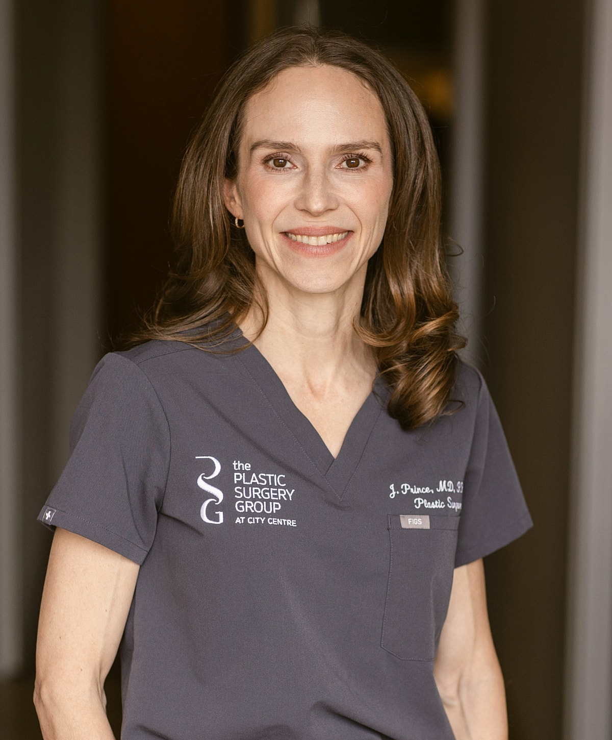 Smiling doctor in a medical consultation setting.