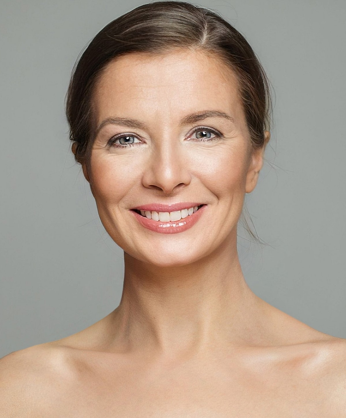 Smiling woman with natural makeup and clear skin